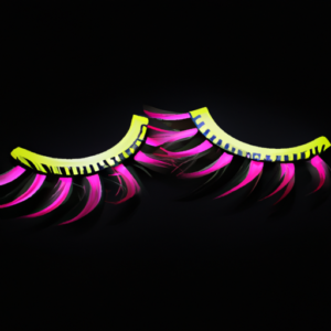 A pair of false eyelashes in a vibrant, colorful pattern against a black background.