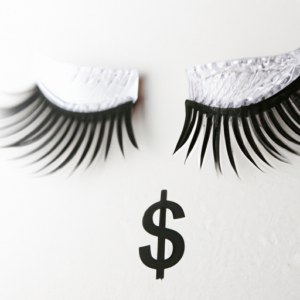 A pair of false eyelashes with a money symbol in the background.