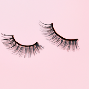 Suggestion: Wispy false eyelashes with light pink background.