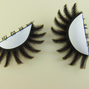 A close-up of a pair of false eyelashes on an eye shaped object.