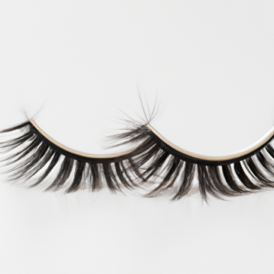 A close-up of a pair of false eyelashes on a clear background.