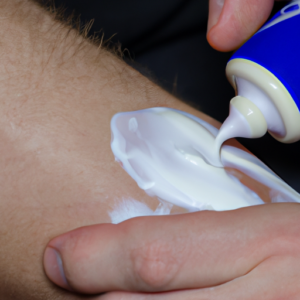 A close-up image of a moisturizing cream being applied to an arm or leg.