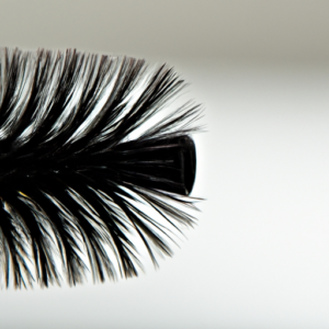 A close-up of a wiggle brush with long lashes extending from the bristles.