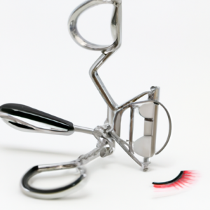 A close-up image of an eyelash curler with a set of false eyelashes on it.