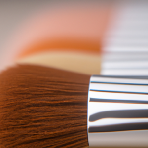 A close-up of a makeup brush with a variety of colorful concealer hues across the bristles.