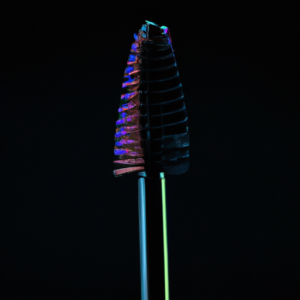 A close-up image of a brightly-colored, voluminous mascara brush against a contrasting, dark background.