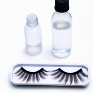 A pair of false eyelashes with a bottle of cleaning solution next to them.